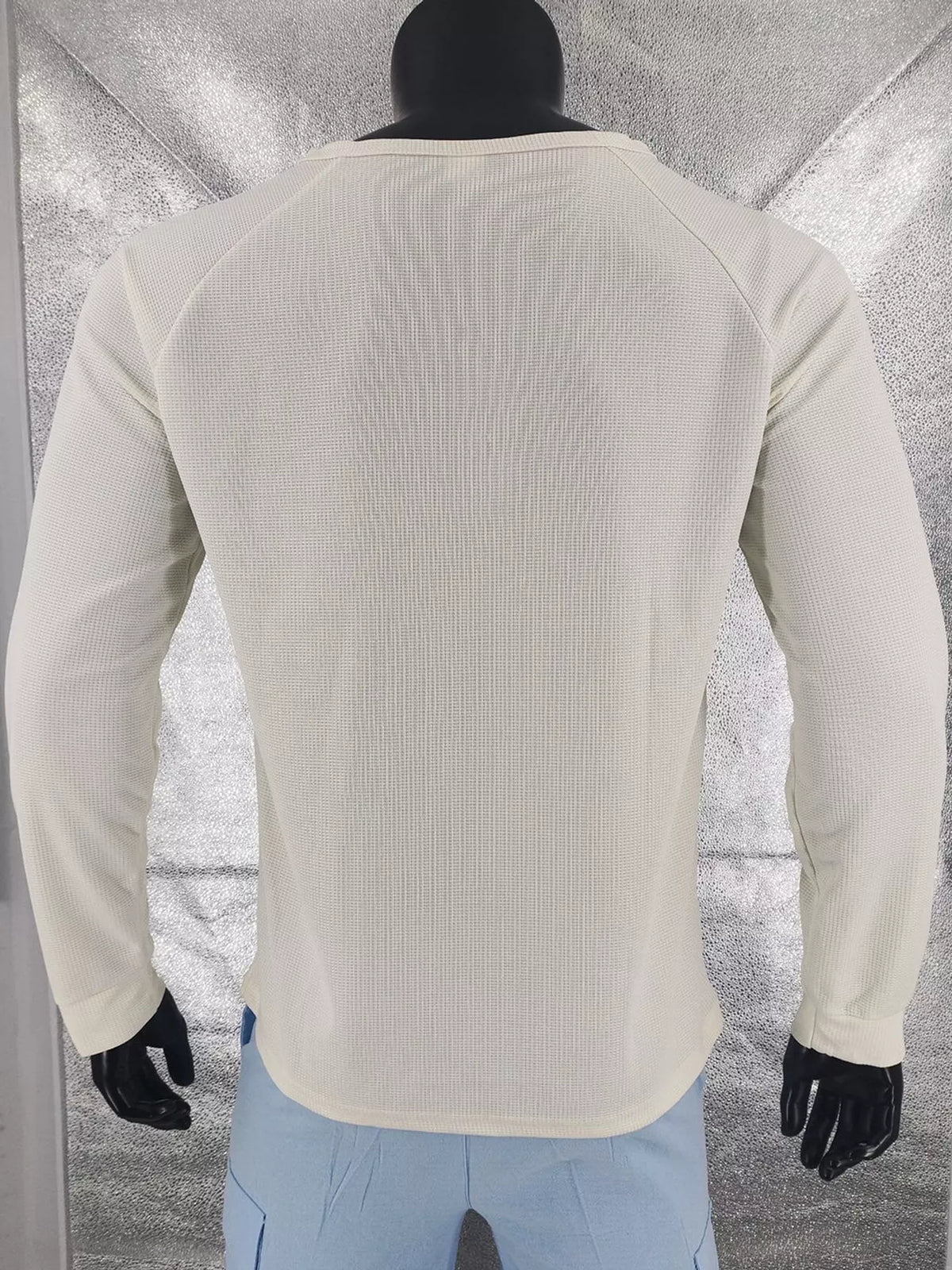 Apricot men’s waffle-knit Henley on a mannequin, back view.