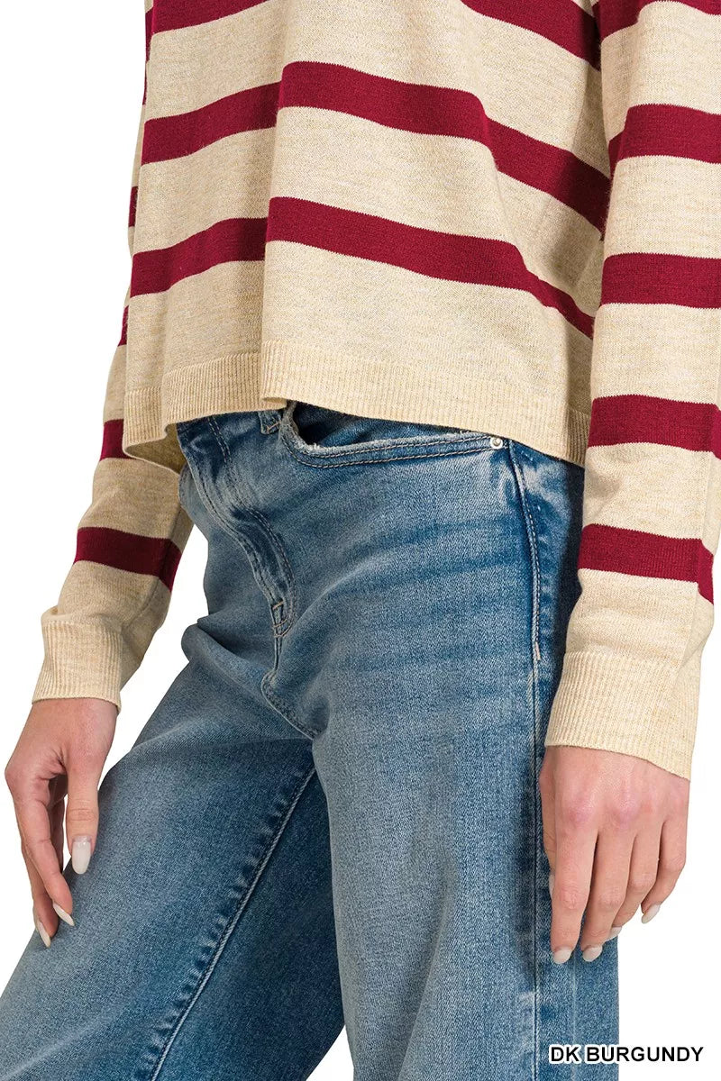 Close view of the sweater’s striped hem and ribbed sleeve cuff; jeans are not included.