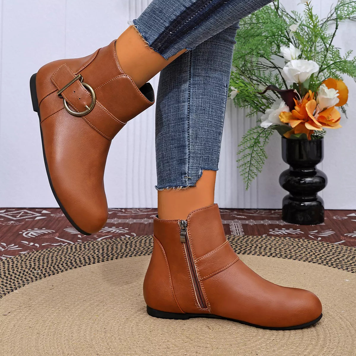 Brown ankle boots showing side profile and zipper