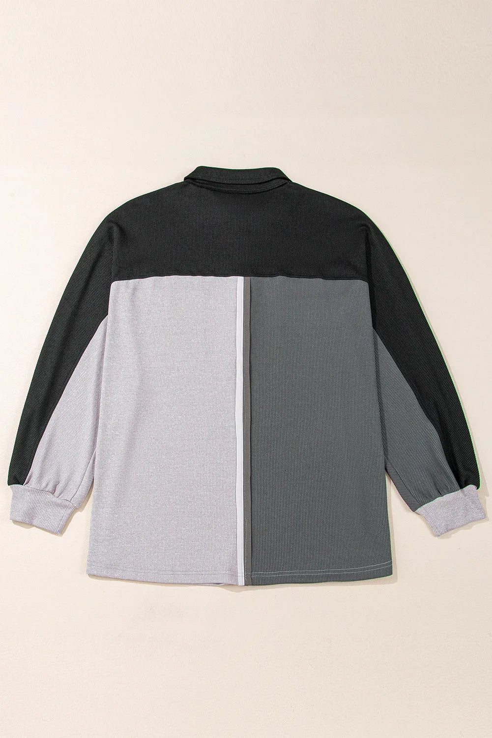 Back flatlay of the dark-gray colorblock long-sleeve sweatshirt showing the complete hem and sleeves
