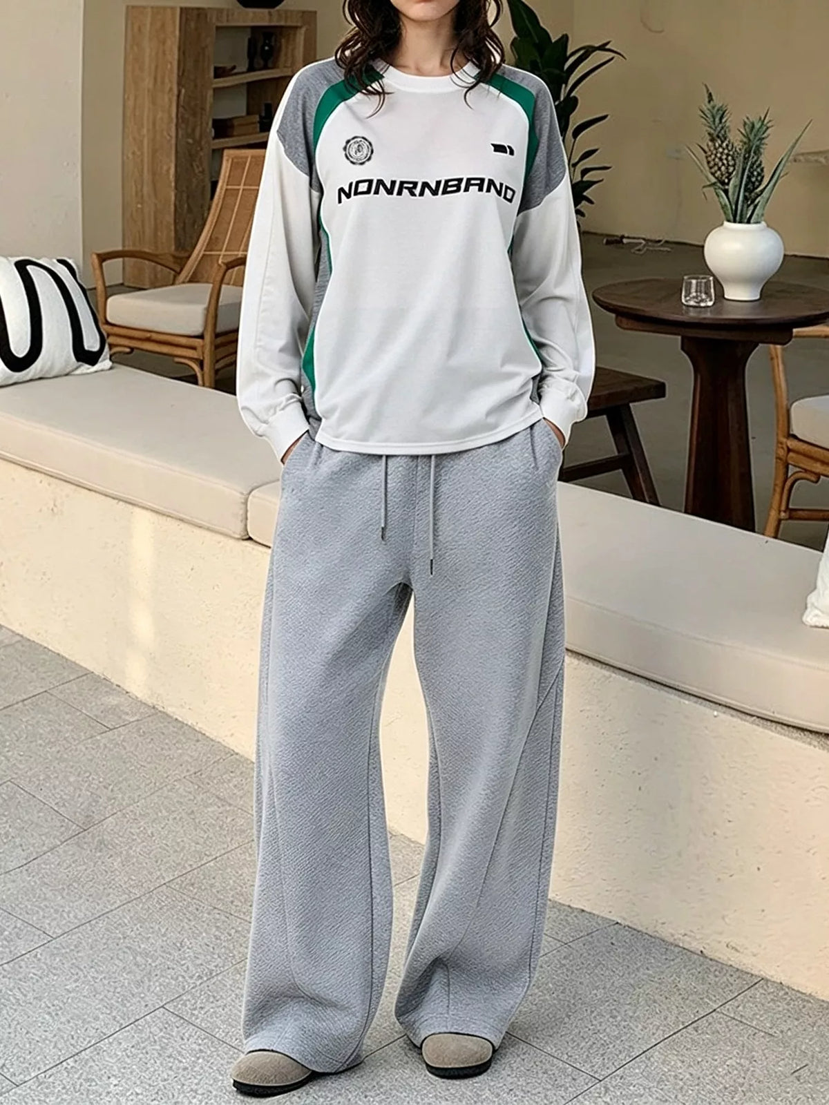 White, green and gray raglan sweatshirt shown in a full-length styled outfit; sweatshirt only