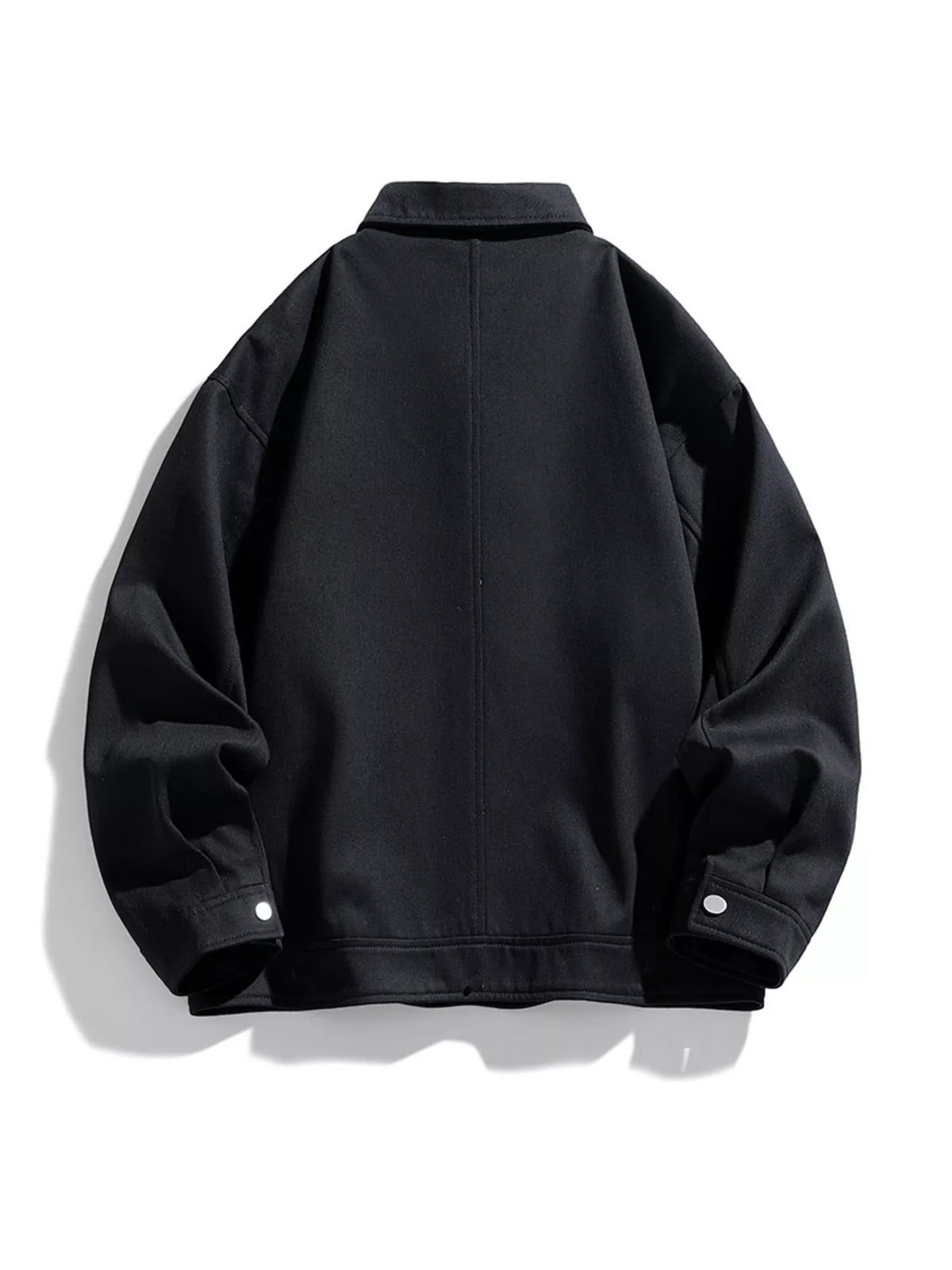 Black jacket shown on its own from the back, with a centre seam and snap cuffs.