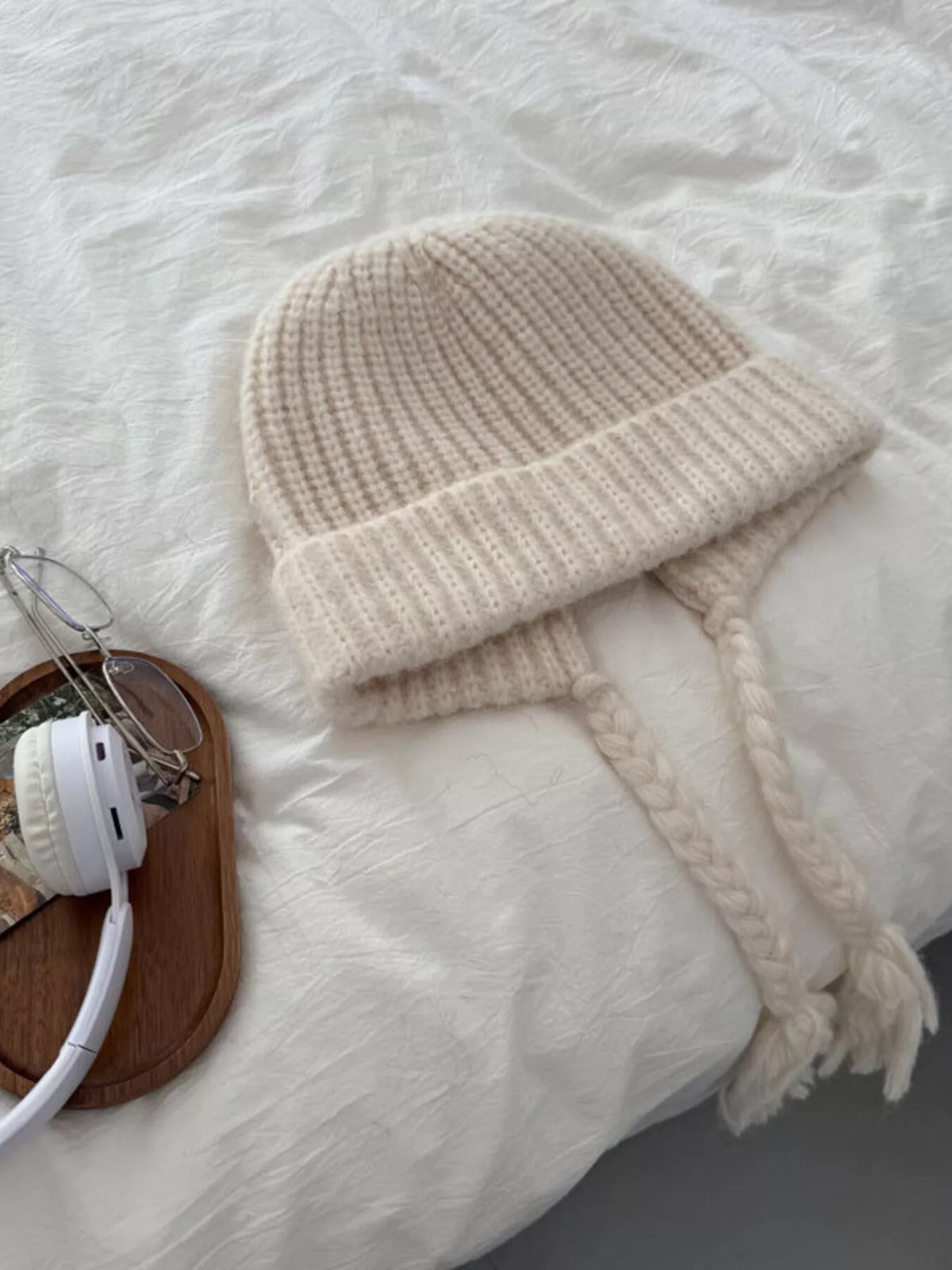 Off-white ribbed knit beanie with braided ties