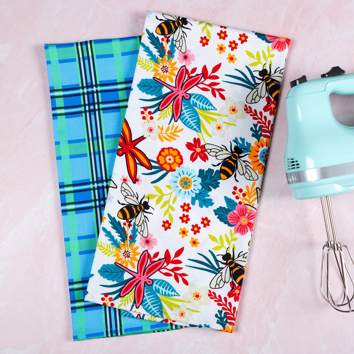 Garden of Dragonflies towel pair with floral and plaid designs; utensils are styling props.