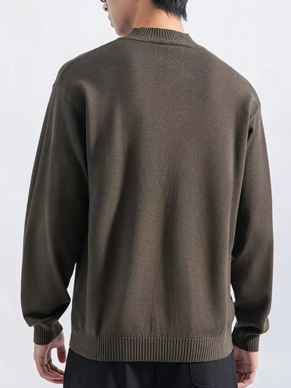 Men's Army Green minimalist mock-neck sweater, back view. Trousers are styling items and are not included.