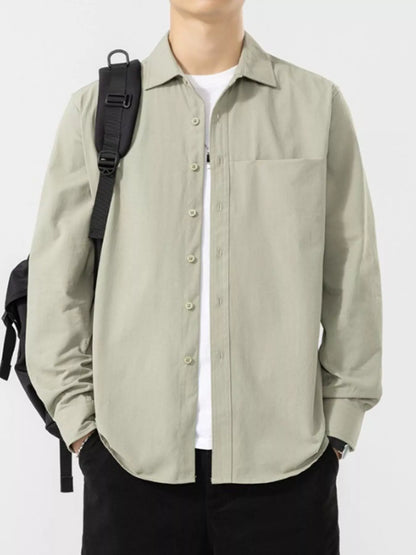Pale sage button-front shirt worn open with a black bag; underlayer, bag and trousers are not included.