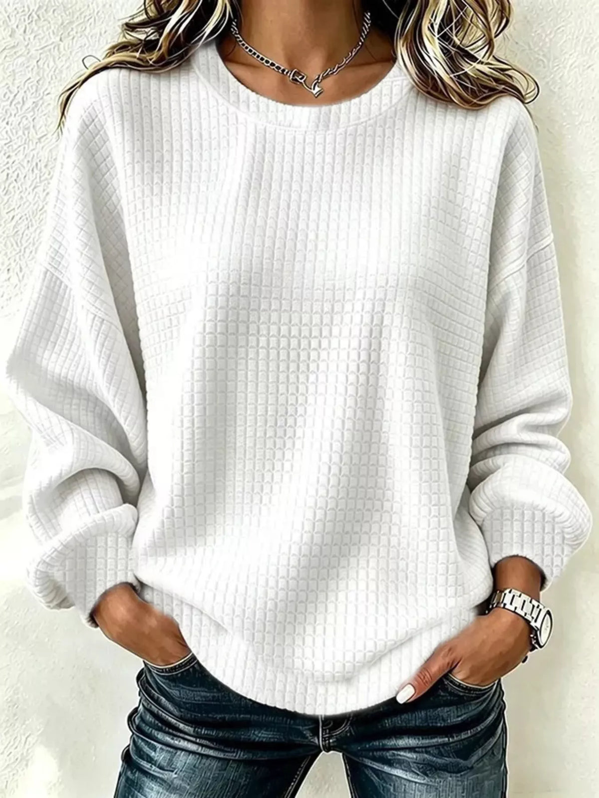 Front view of a White long-sleeve crew-neck waffle-knit sweatshirt. One top only.