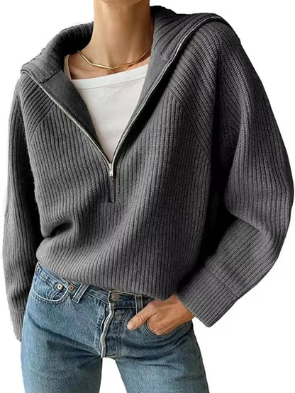 Half-zip long-sleeve ribbed sweater with a high collar.