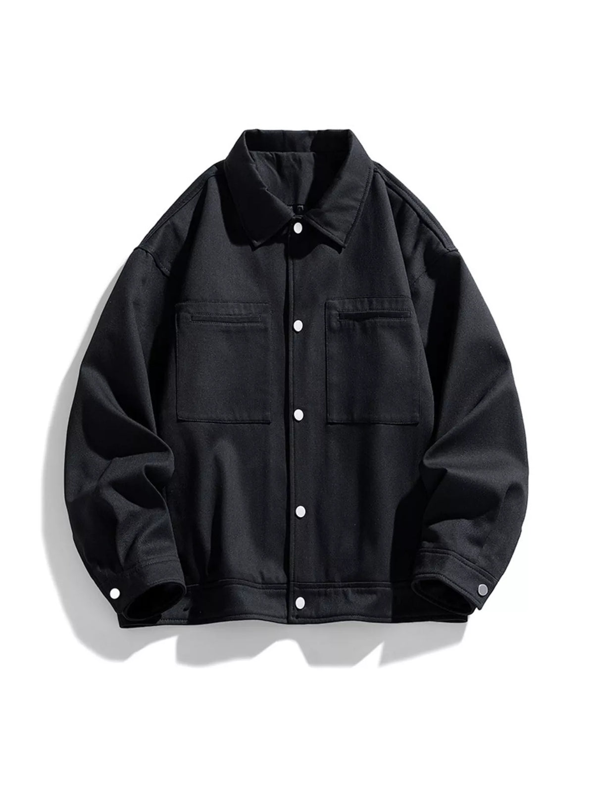 Black snap-front jacket shown on its own from the front, with two chest patch pockets.