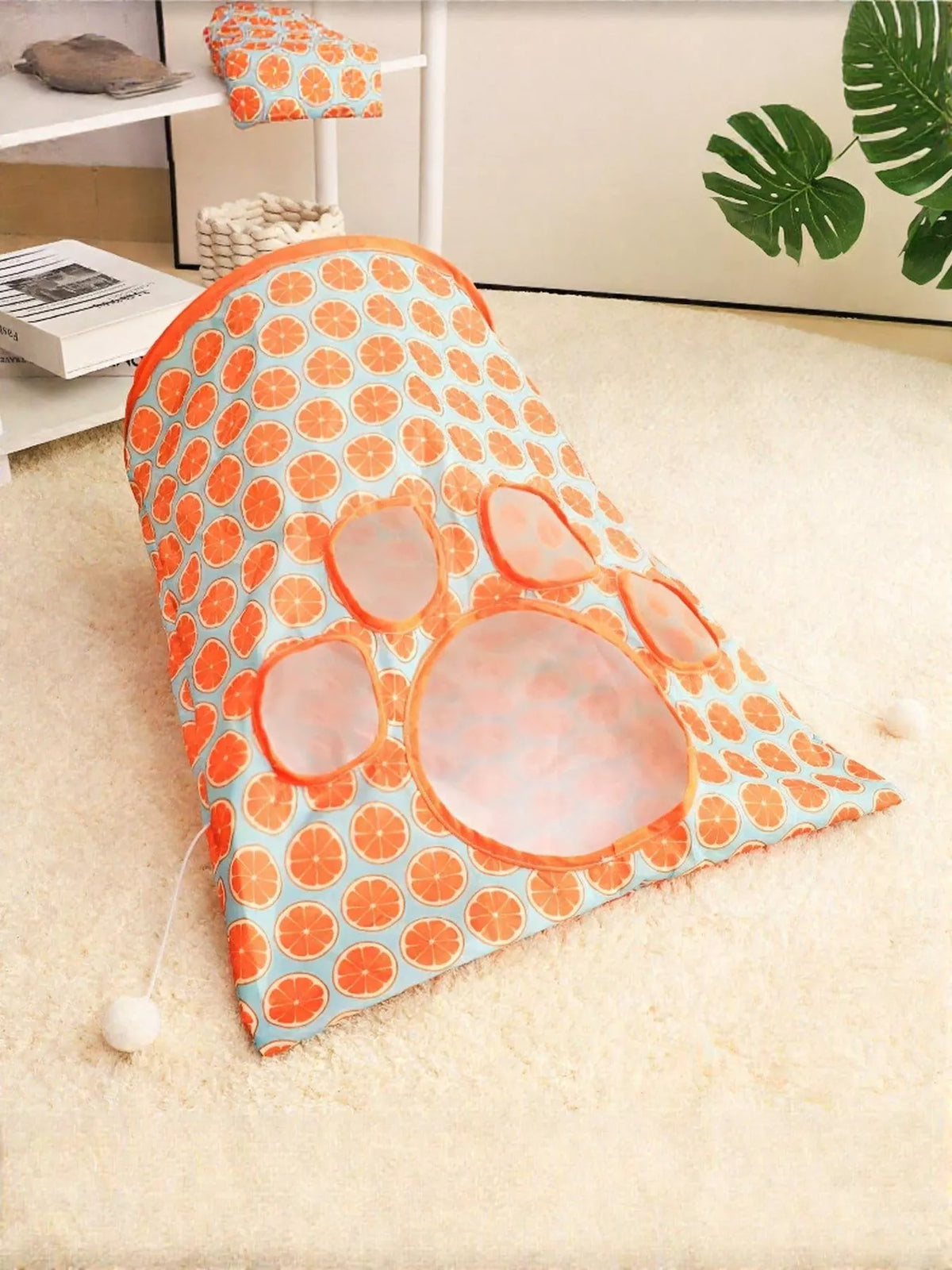Orange Pattern collapsible cat tunnel folded flat with orange-trimmed openings