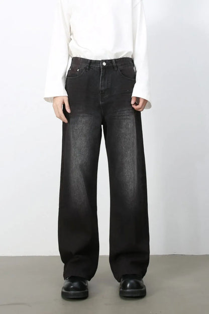 Front view of men's dark-wash loose-fit wide-leg jeans. One pair of jeans only.