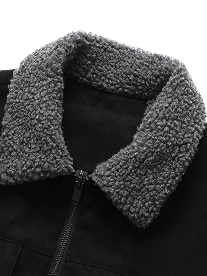 Close-up of the Black jacket's plush collar and front zipper.