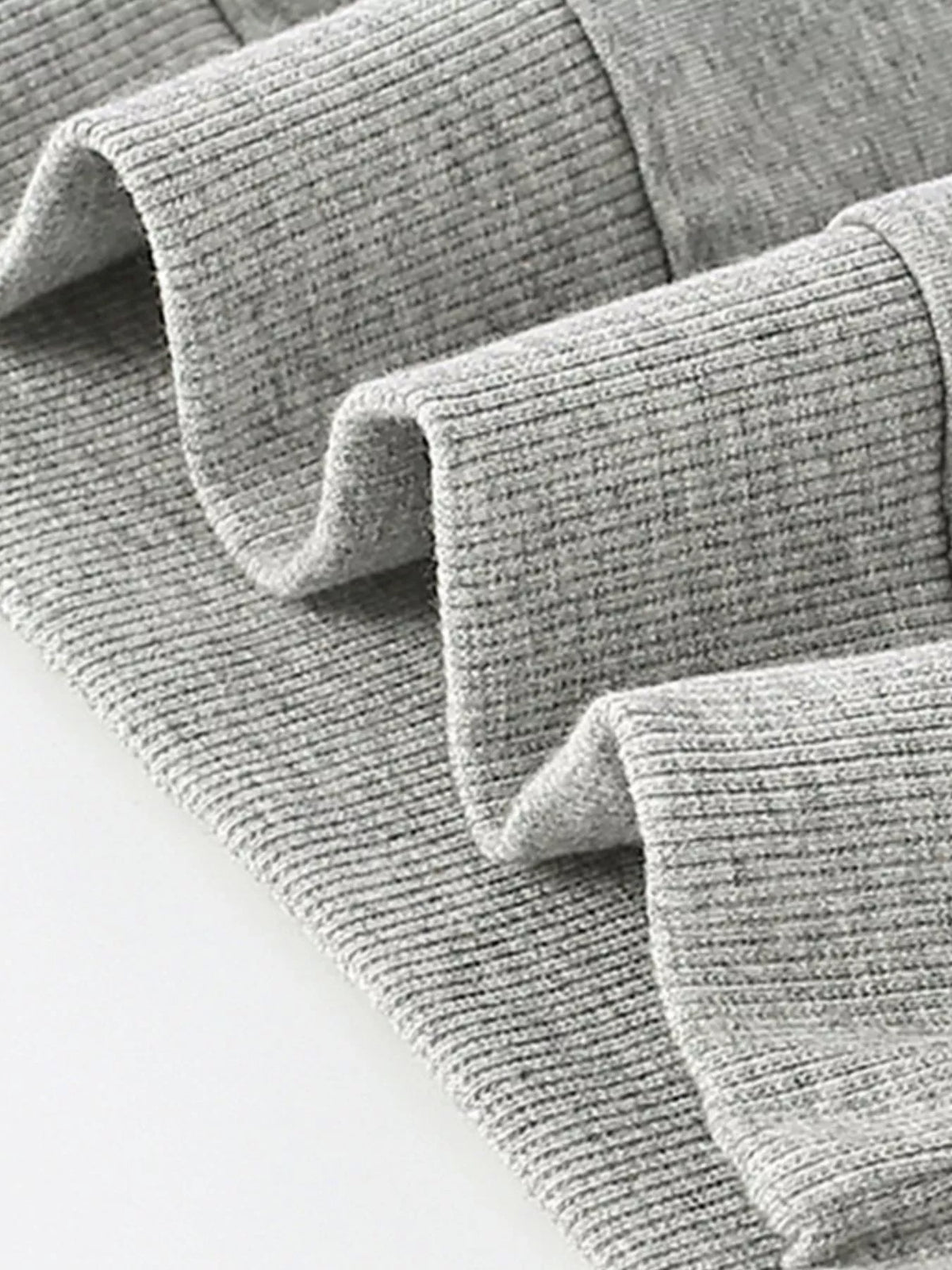 Close view of the gray sweatshirt's ribbed cuffs.