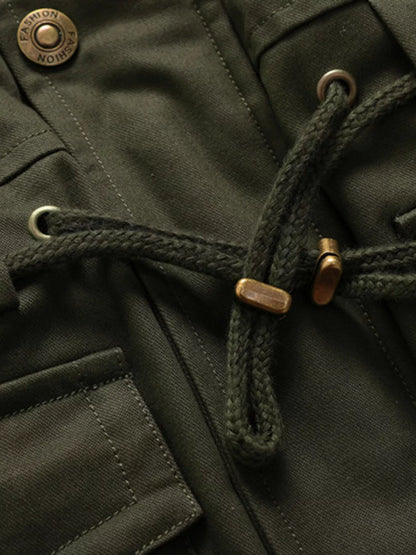 Close-up of the Army Green jacket waist drawcord, eyelets, cord ends and snap fastener.