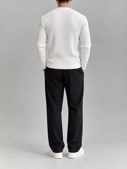 White ribbed knit top, modelled rear view. Trousers and shoes are not included.