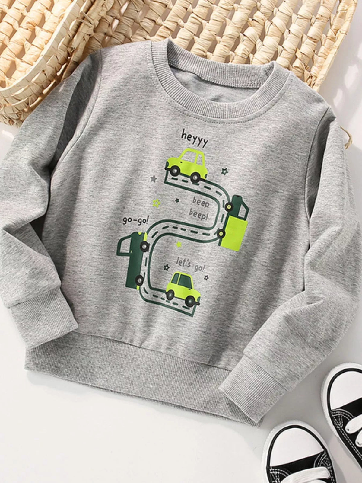 Gray children's long-sleeve sweatshirt with a green car-and-road graphic, shown flat; shoes and other props are not included.