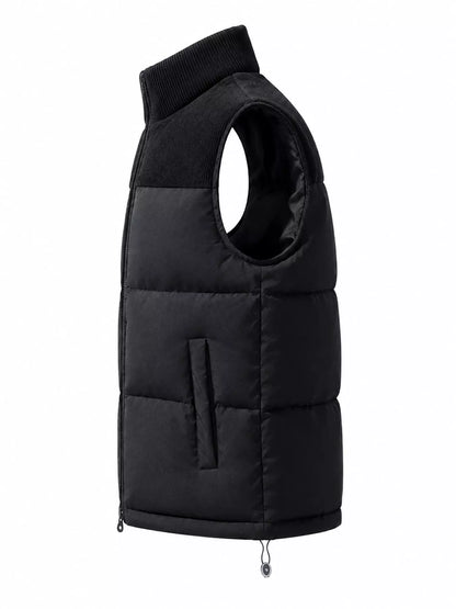 Black men's corduroy-panel puffer vest, side view. One vest is sold.