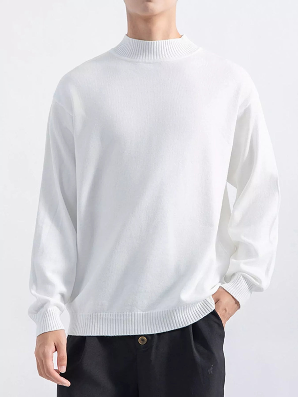 Men's White minimalist mock-neck sweater, alternate front view. Trousers are styling items and are not included.