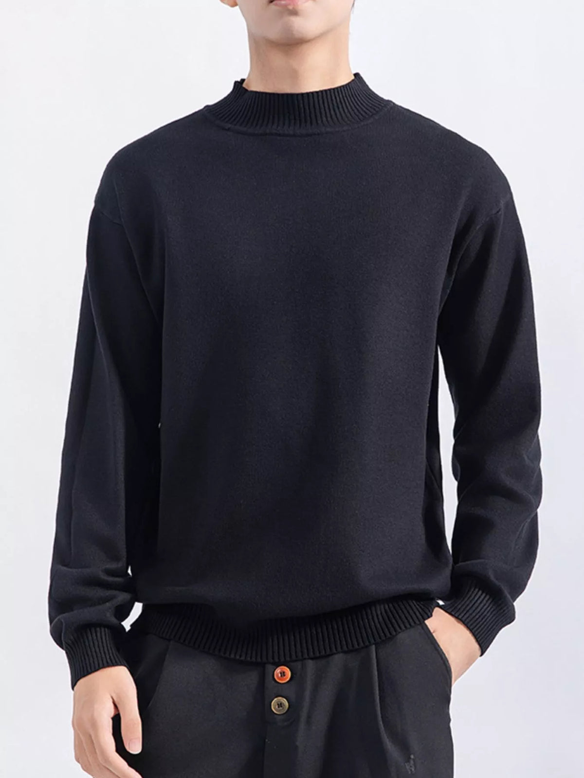 Men's Black minimalist mock-neck sweater, alternate front view. Trousers are styling items and are not included.
