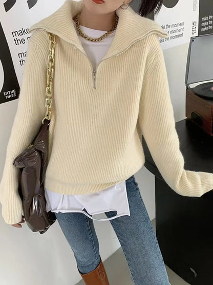 Half-zip long-sleeve ribbed sweater with a high collar.