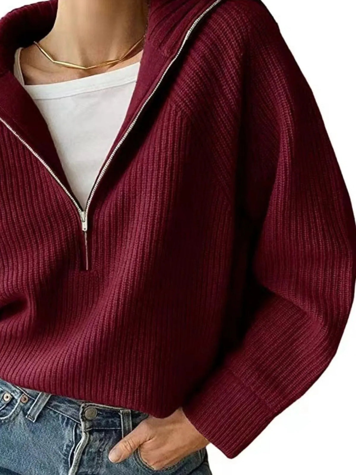 Half-zip long-sleeve ribbed sweater with a high collar.