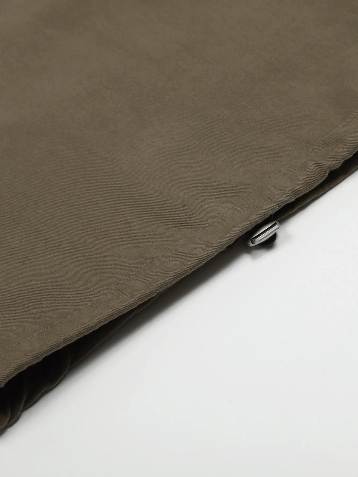 Olive brown men's wide-leg drawstring trousers — hem detail