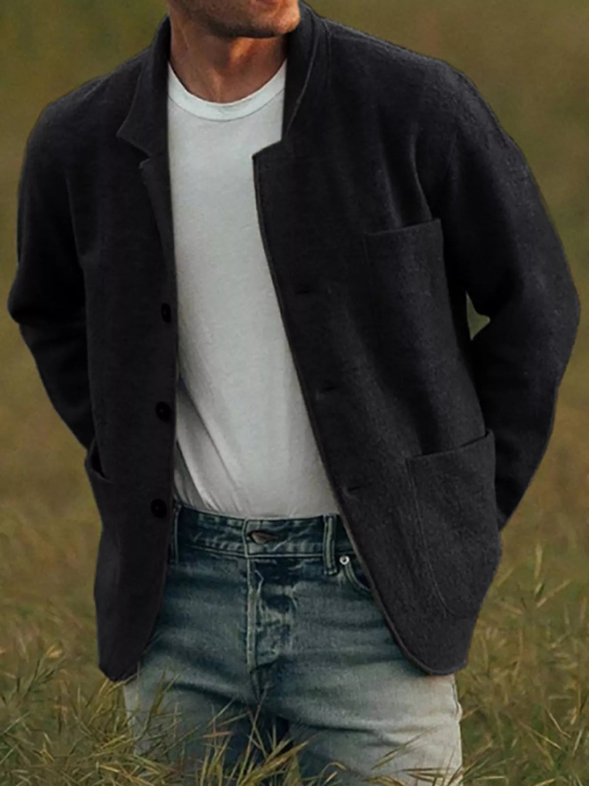 Black men's textured button-up jacket with a notched collar and patch pockets; shirt and jeans are not included.
