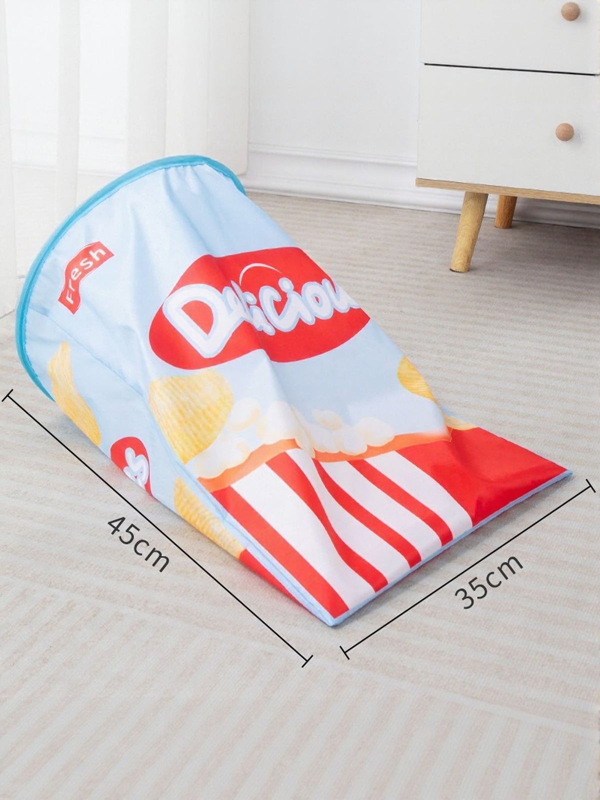 Blue snack-package-print cat tunnel with 45 by 35 centimeter dimensions.