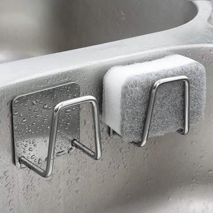 Two mounted sink-side holders with a cleaning pad; pad and sink are excluded.