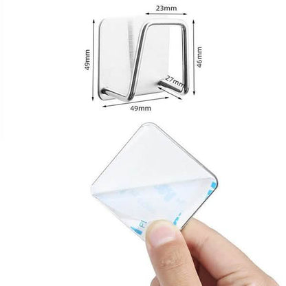 Supplier dimension and adhesive backing guide for one holder; hand is shown for installation.