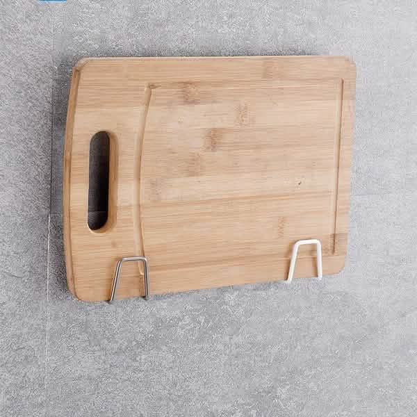 Two mounted holders used as a support for a cutting board; board is excluded.