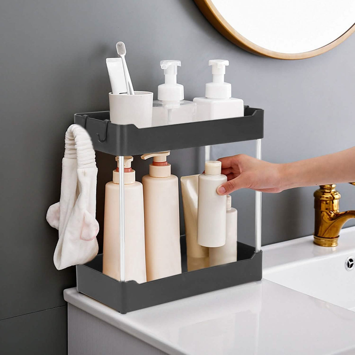 One two-tier organizer on a bathroom counter; toiletries and room furnishings are excluded.