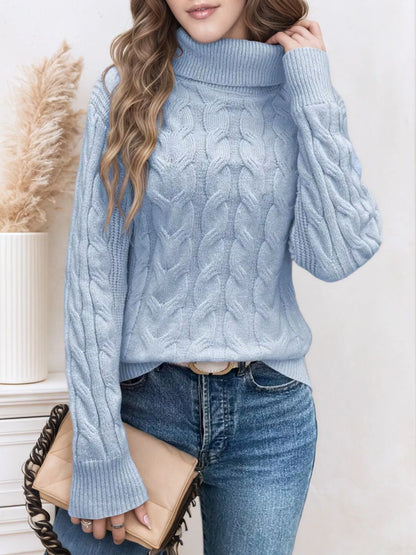 Cable-knit turtleneck sweater with long sleeves.