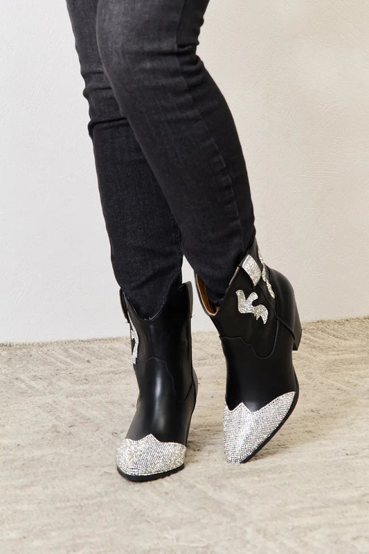 Black rhinestone pointed-toe ankle boots, front view with trousers for styling