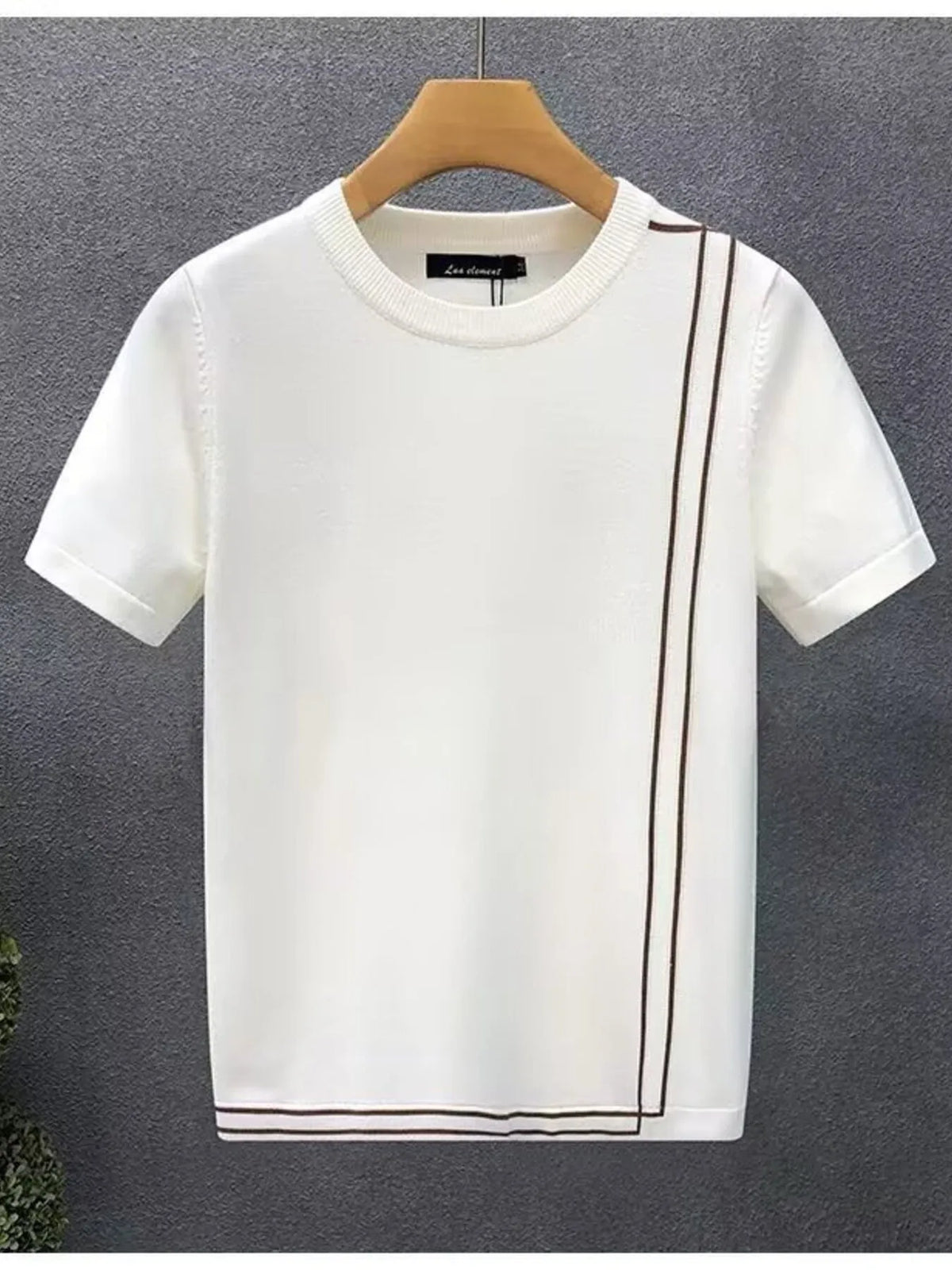 White short-sleeve contrast-trim T-shirt on a hanger, front view.