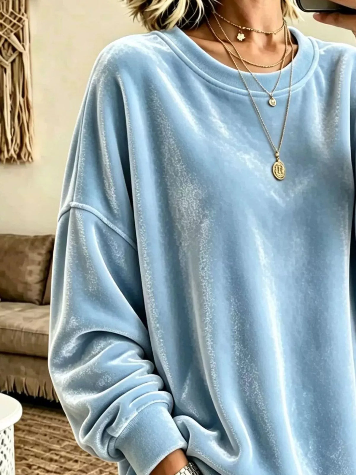 Velvet crewneck sweatshirt — Sky Blue neckline and fabric detail. One sweatshirt only; jewellery and jeans are styling items, not included.