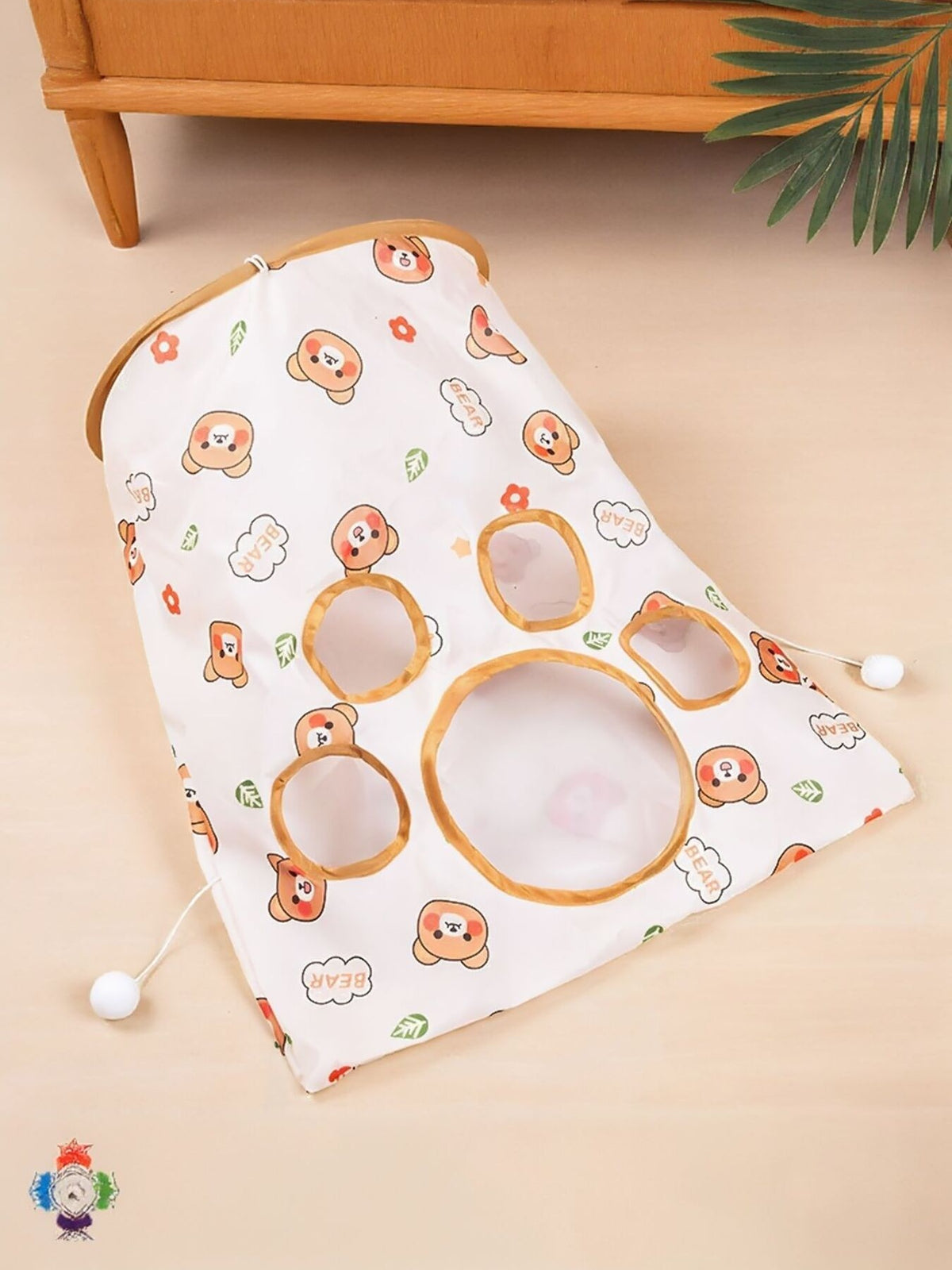 White bear-print cat tunnel panel laid flat with round openings.