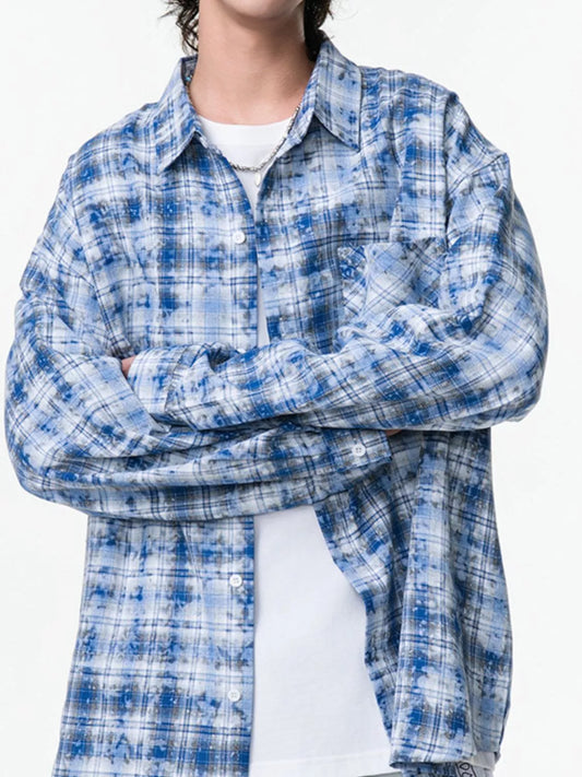 Men's blue plaid long-sleeve shirt, front view with arms folded. Shirt only; white undershirt not included.