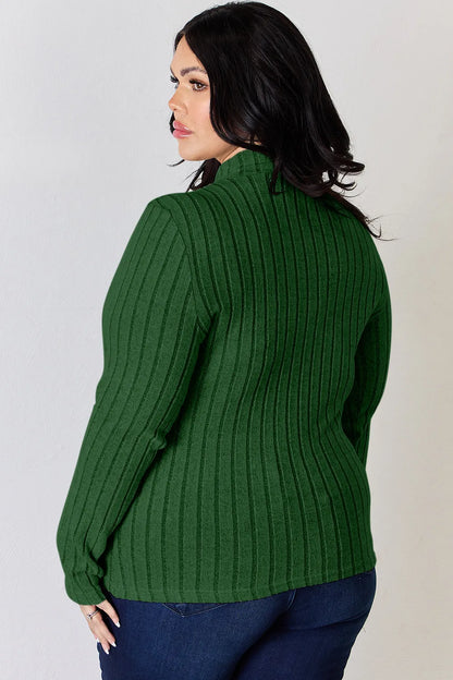 Green ribbed mock-neck long-sleeve top, product view; one top included, jeans and accessories excluded