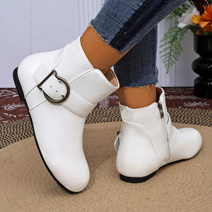White round-toe ankle boots with buckle detail