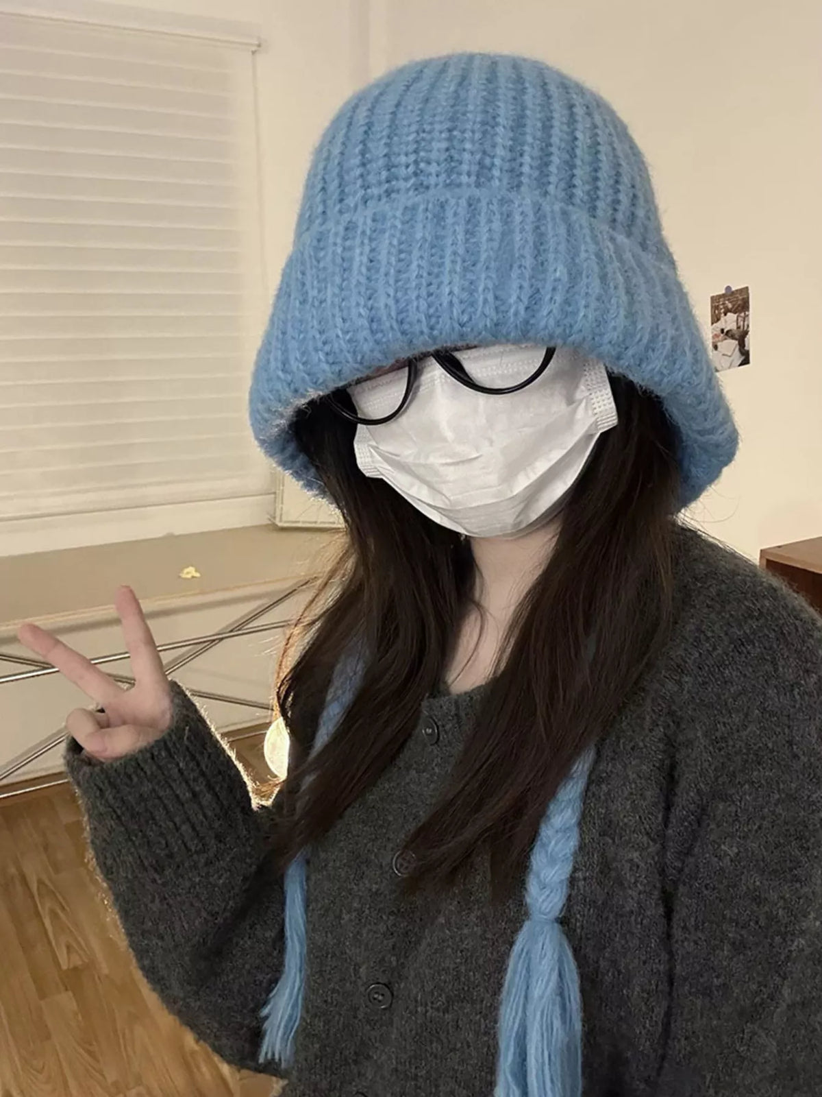 Blue braided knit beanie shown from an angle