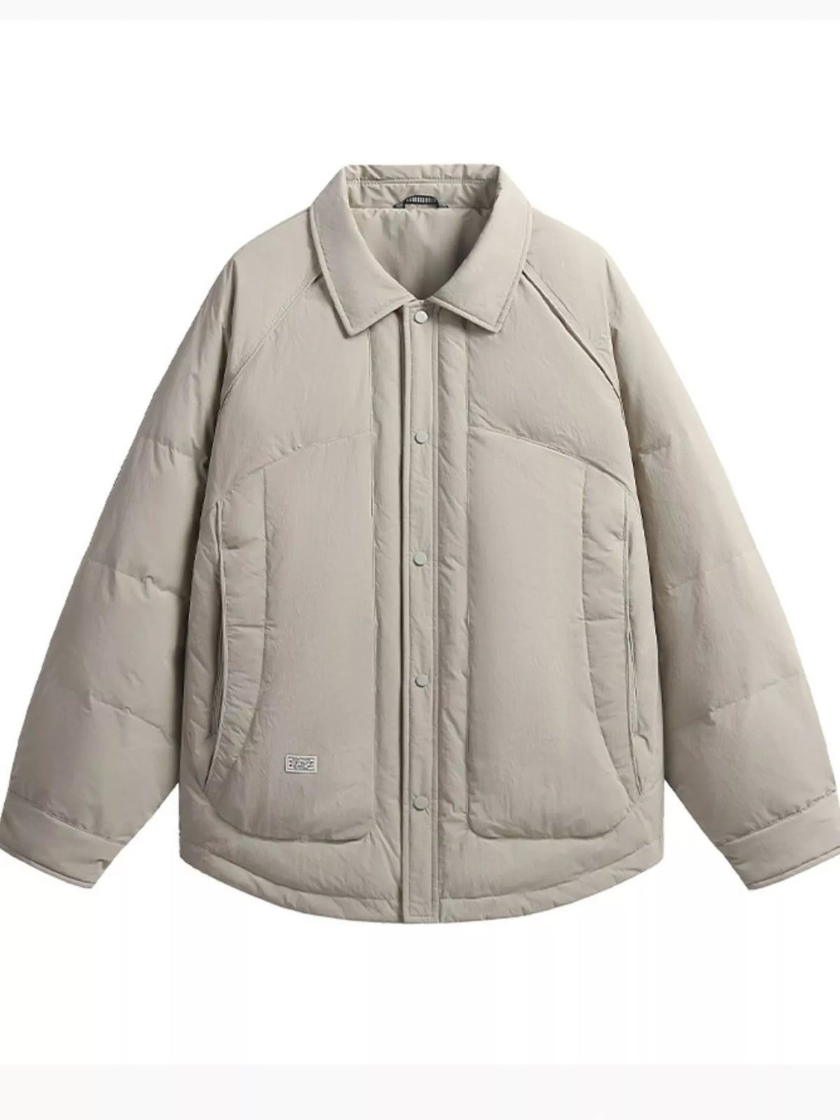 Light taupe padded jacket front showing a point collar, snap placket, large lower pockets and curved hem.