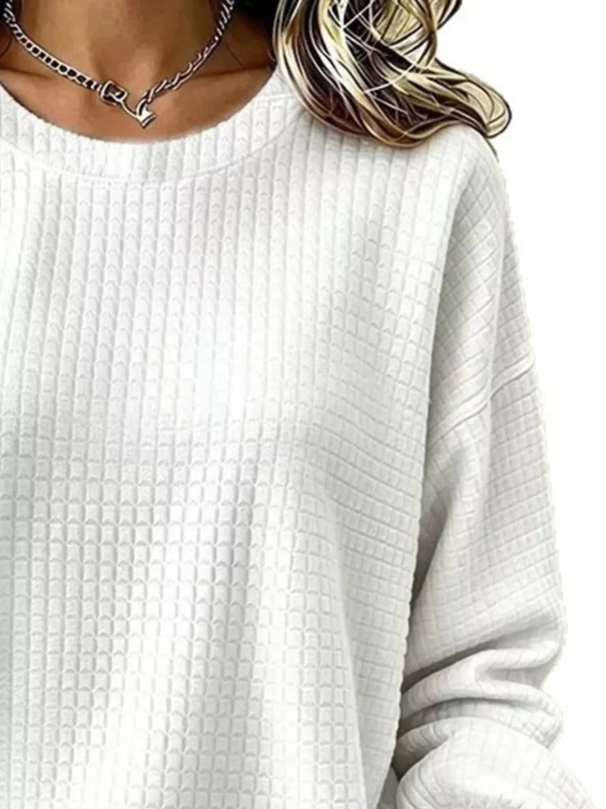Close-up of the White sweatshirt's crew neckline and waffle-knit texture.