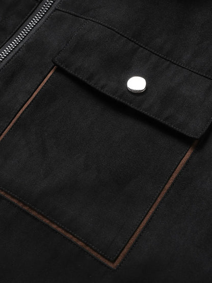 Close-up of the Black jacket's flap chest pocket and snap button.