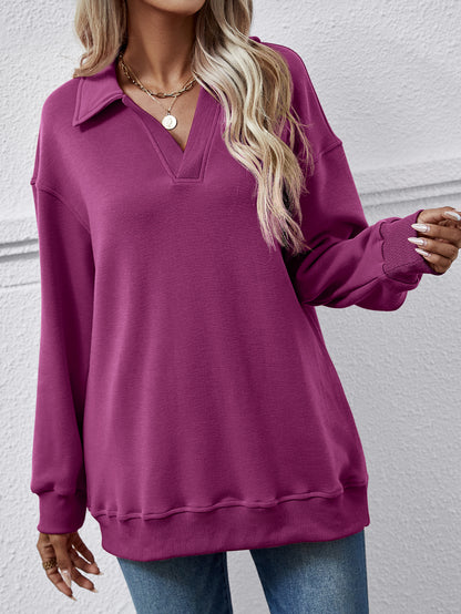 Collared dropped-shoulder sweatshirt with long sleeves.