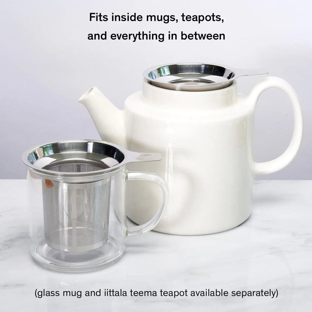 Stainless tea infuser shown with a mug and teapot
