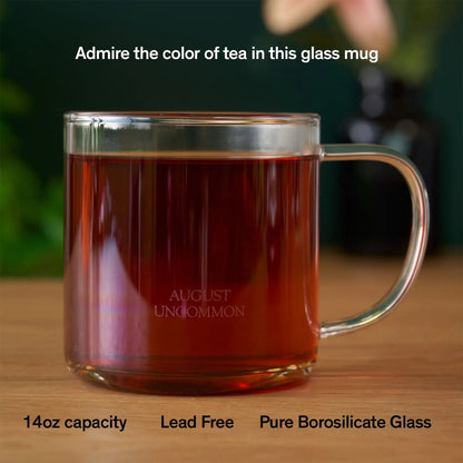 August clear glass tea mug filled with tea; tea not included