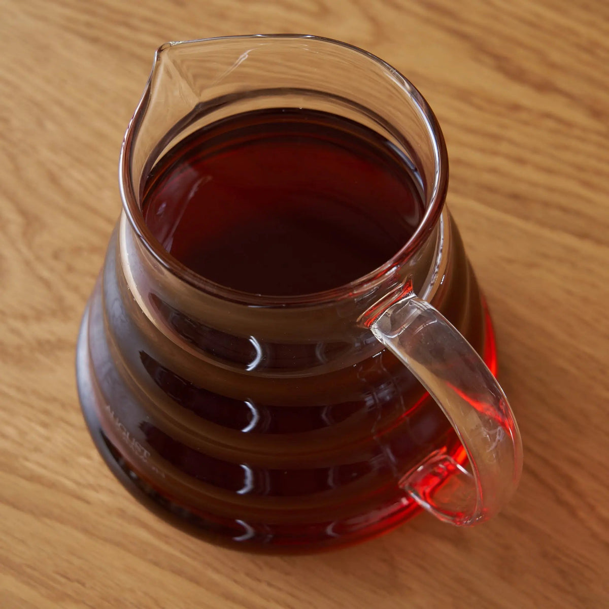 Top view of August glass teapot filled with tea; tea not included