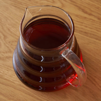Top view of August glass teapot filled with tea; tea not included