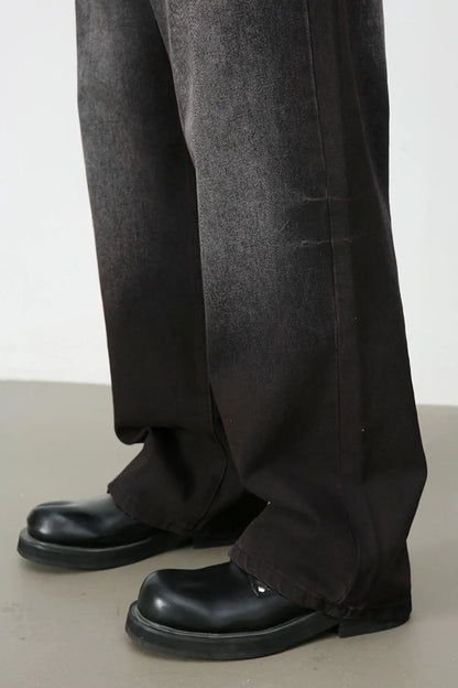 Close-up of the dark-wash jeans' wide leg and hem.